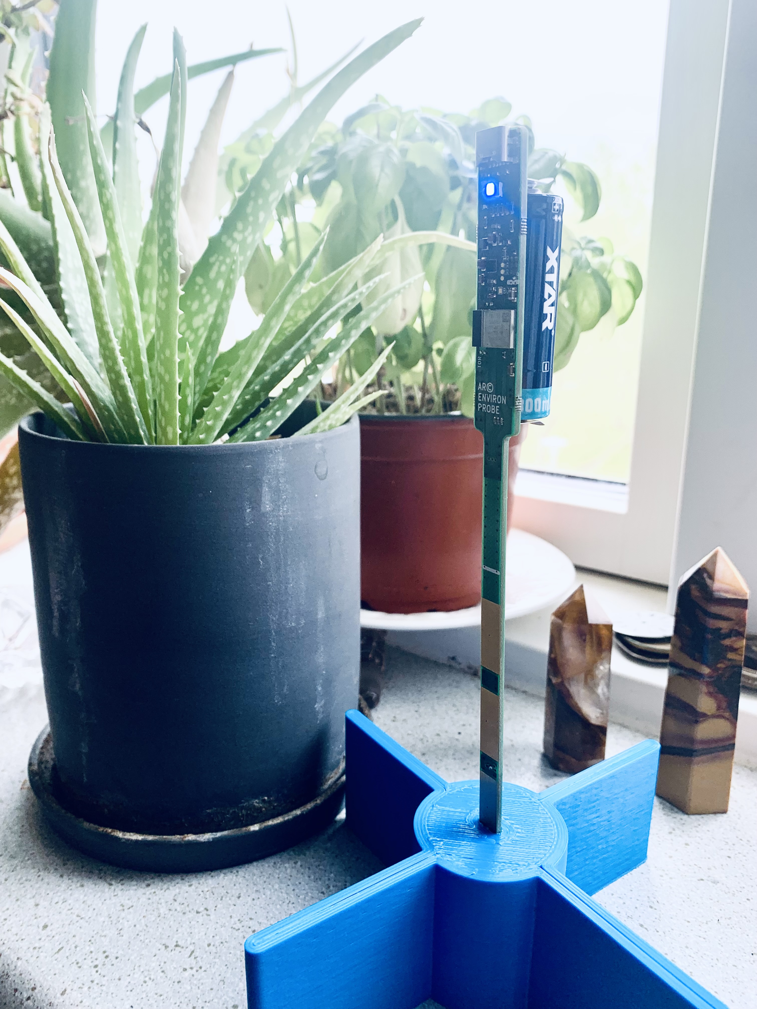 Battery powered ARC-Probe prototype in bench bring-up beside a plant